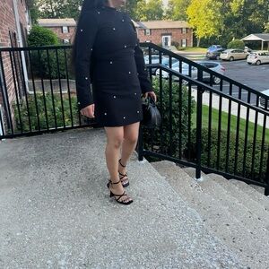 Size 4 color Black mini length night neckline.. only for one occasion one night